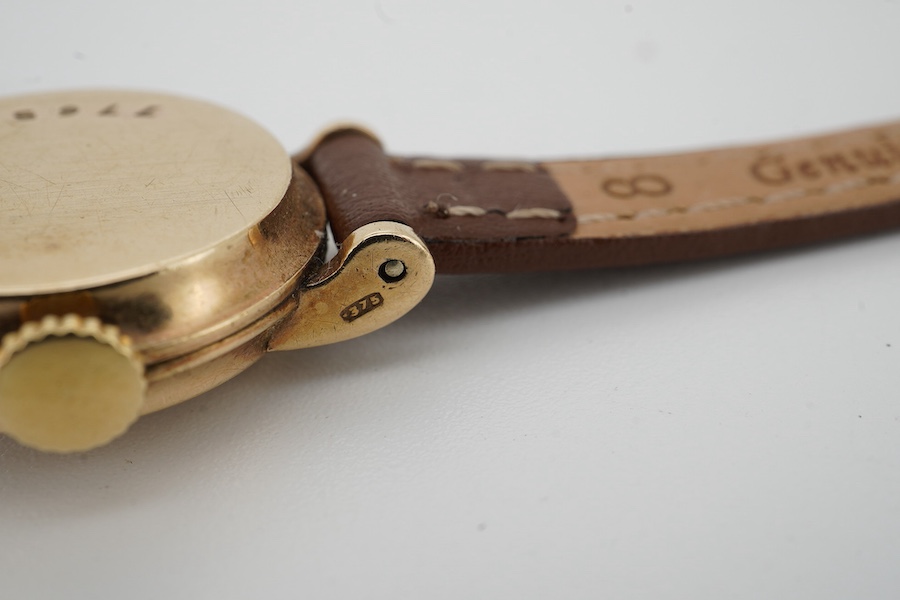 A lady's 9ct gold Jaeger LeCoultre manual wind wrist watch, with baton and quarterly Arabic numerals, cased diameter 20mm, on an associated leather strap, no box or papers.